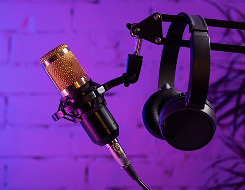 orange glowing mic on purple background